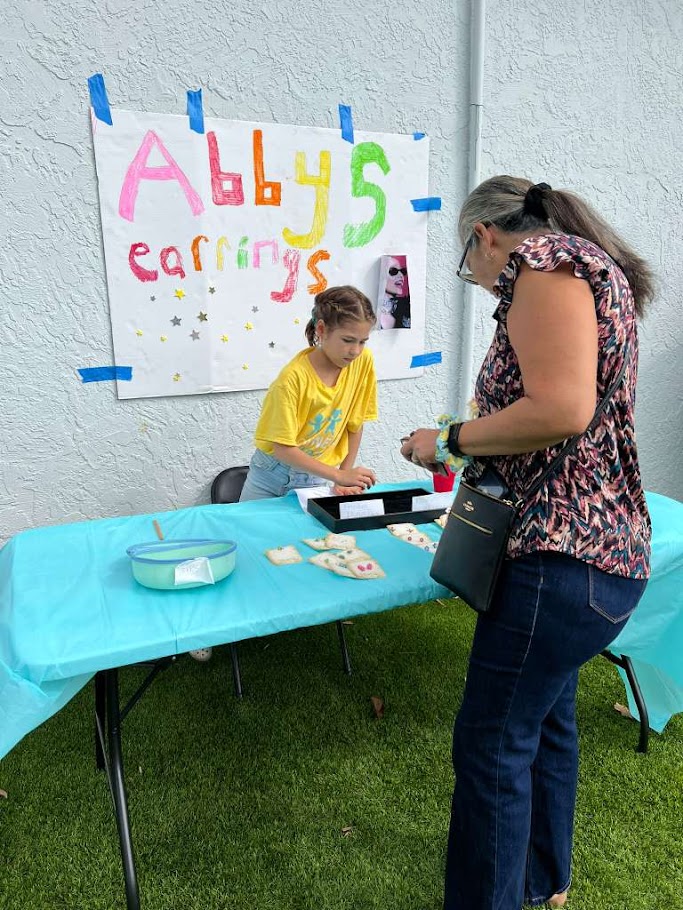 A Connect student presenting a project at the Kids Business Fair