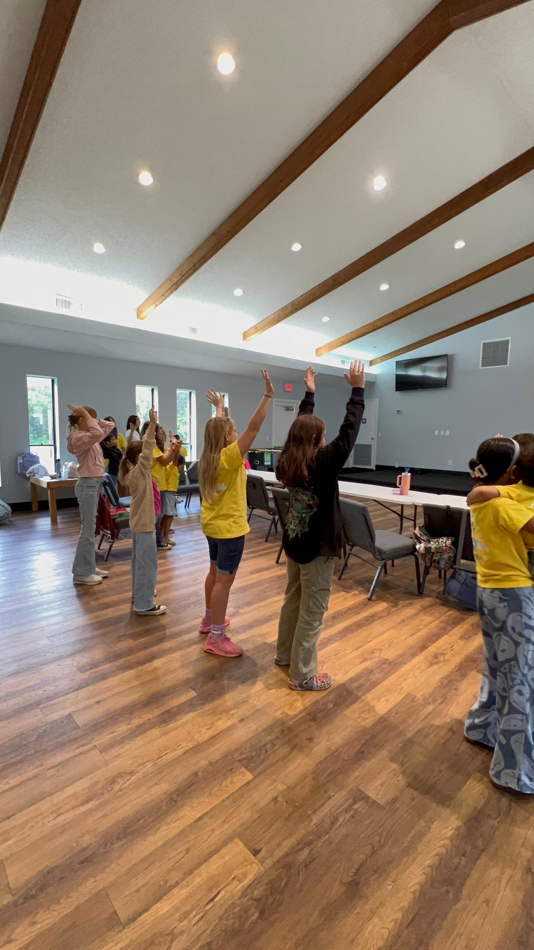 Connect students raising their hands during a hands-on lesson